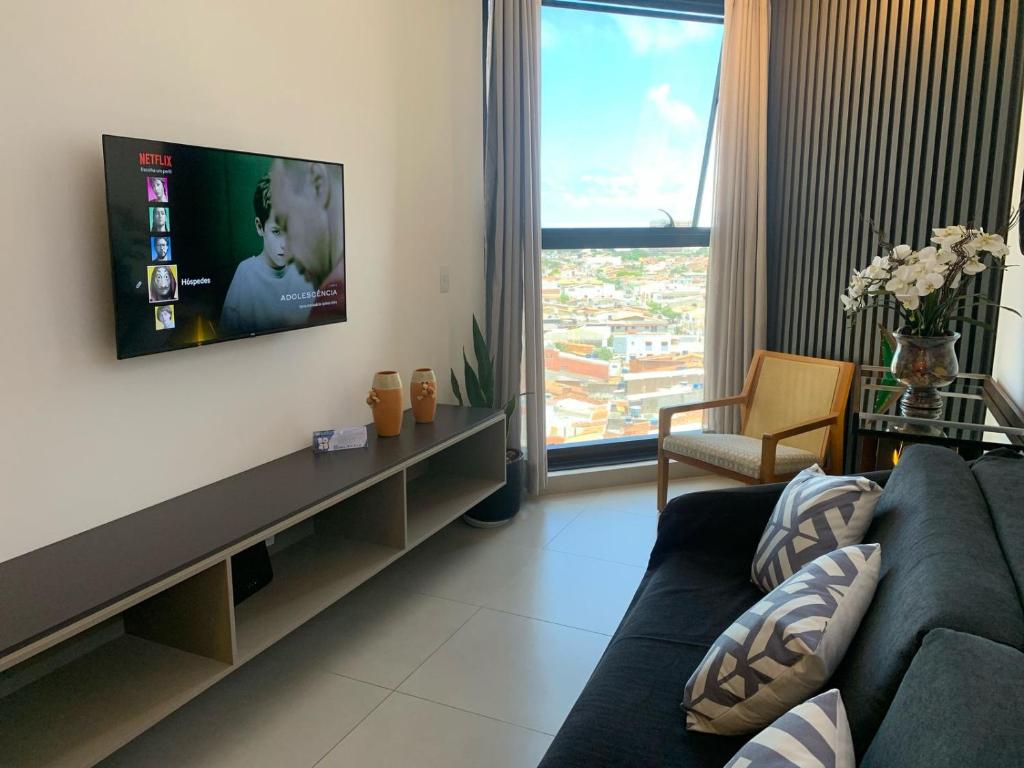 TV a/nebo společenská místnost v ubytování Quarto e Sala na Ponta Verde e Pajuçara