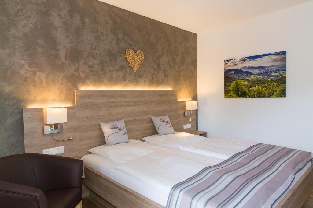 Postel nebo postele na pokoji v ubytování Gästehaus Funk