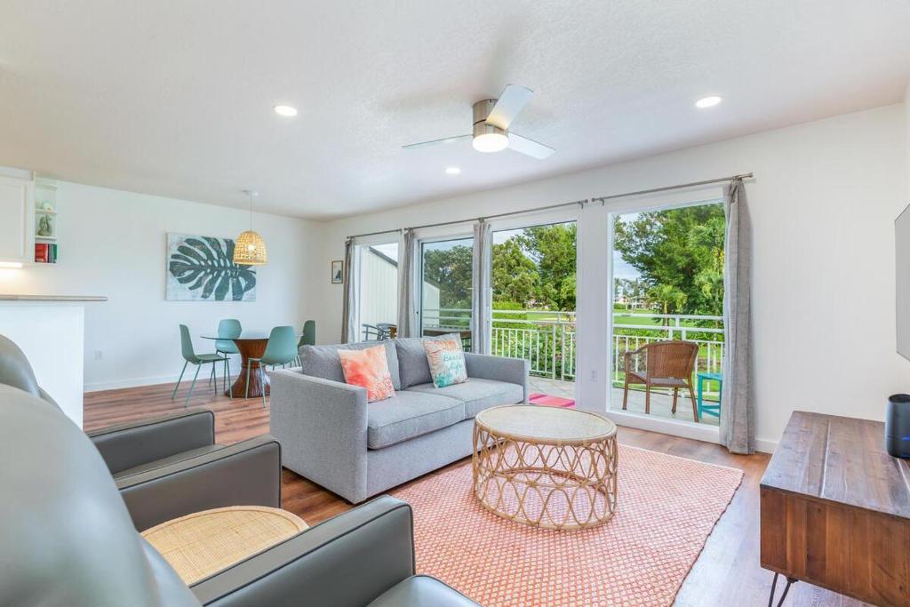 a living room with a couch and a table at Emmalani Court 423 in Princeville