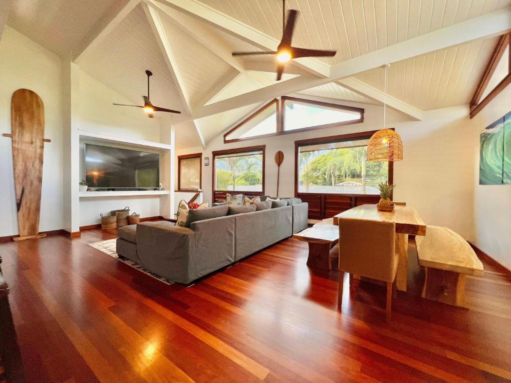 a living room with a couch and a table at Hale Aku in Hanalei