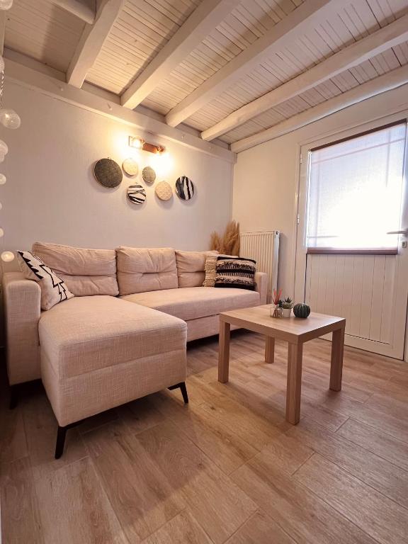 a living room with a couch and a table at Tramontana House2 in Skiathos