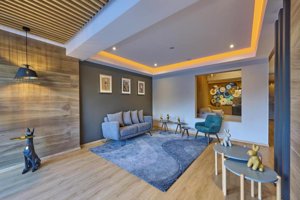 A styled lounge offers a sofa, armchairs, and a small seating area.
