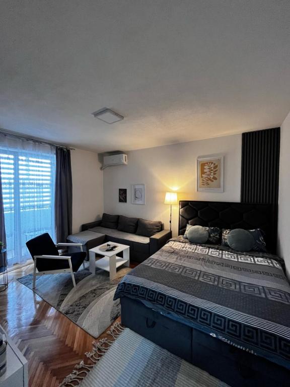 Postel nebo postele na pokoji v ubytování Apartman RISTIC