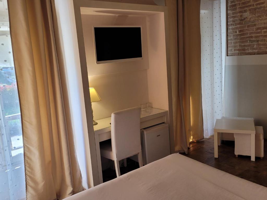 Postel nebo postele na pokoji v ubytování Relais Casetta56
