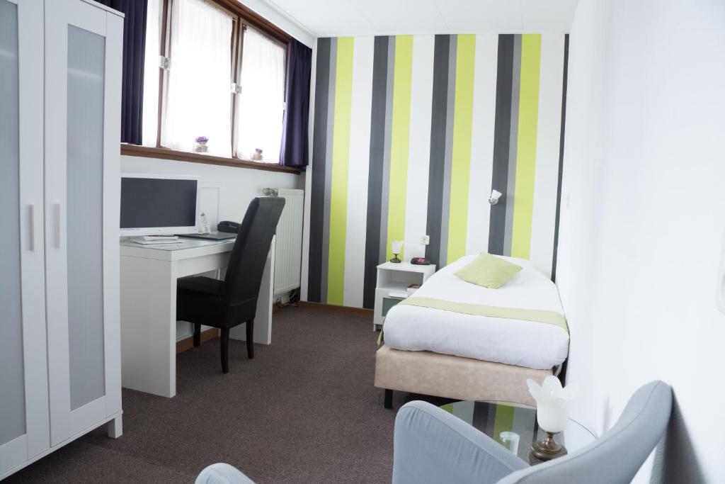 Postel nebo postele na pokoji v ubytování Hotel Het Landhuis