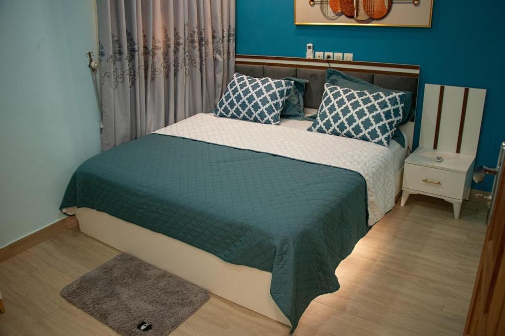 Katil atau katil-katil dalam bilik di Cozy Avedji Apartment