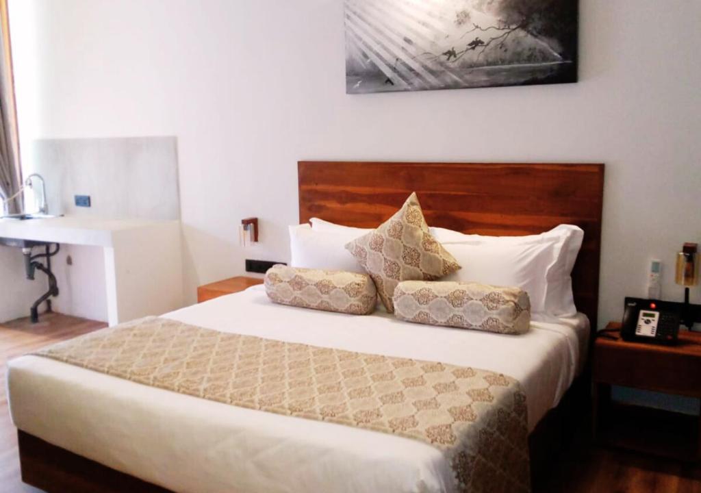 Postel nebo postele na pokoji v ubytování Diyakawa Boutique Hotel