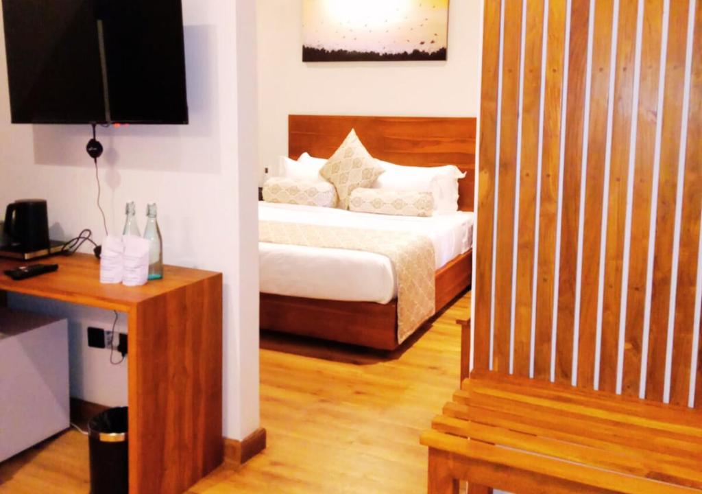 Postel nebo postele na pokoji v ubytování Diyakawa Boutique Hotel