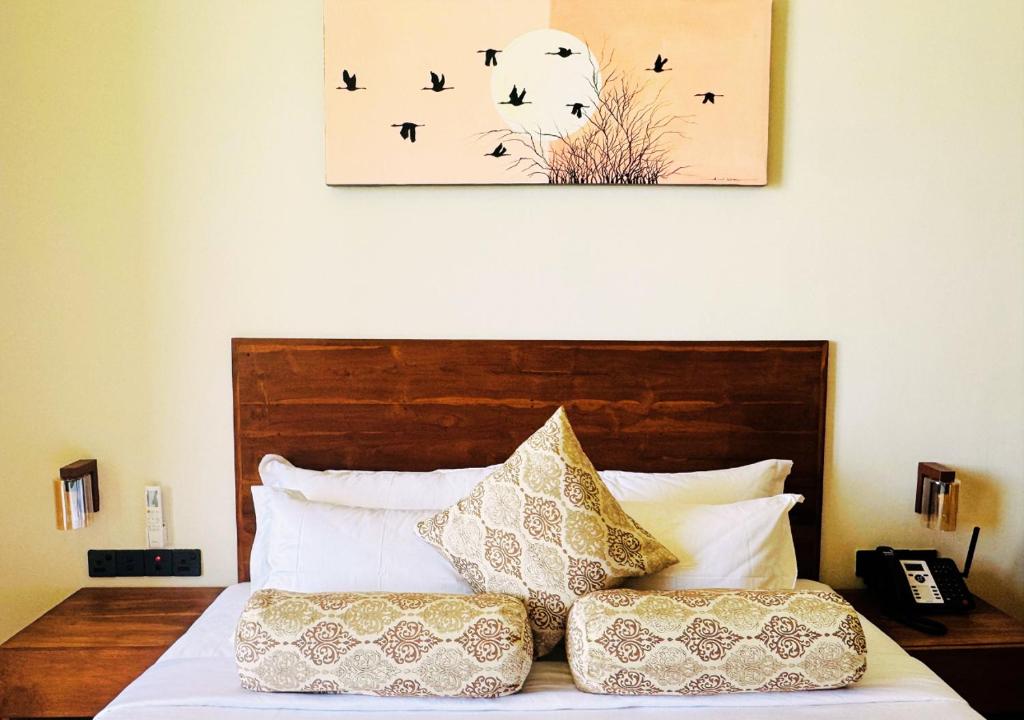 Postel nebo postele na pokoji v ubytování Diyakawa Boutique Hotel