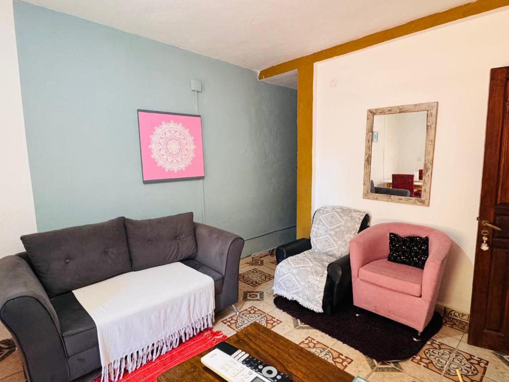 a living room with a couch and a chair at Misiones Depa33 in Posadas