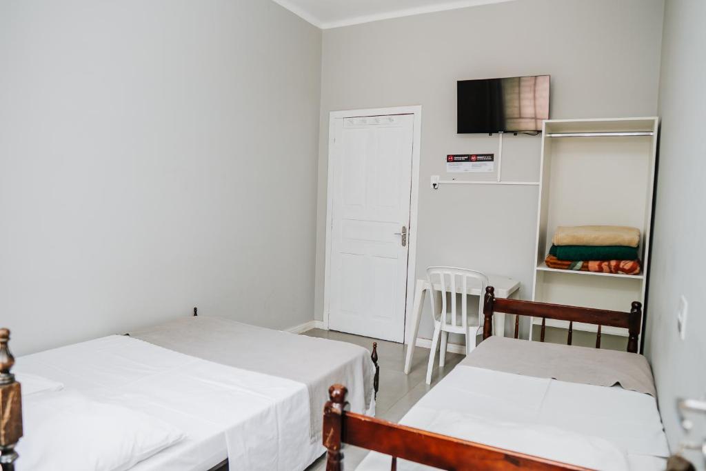 Postel nebo postele na pokoji v ubytování Hotel Pinheirinho