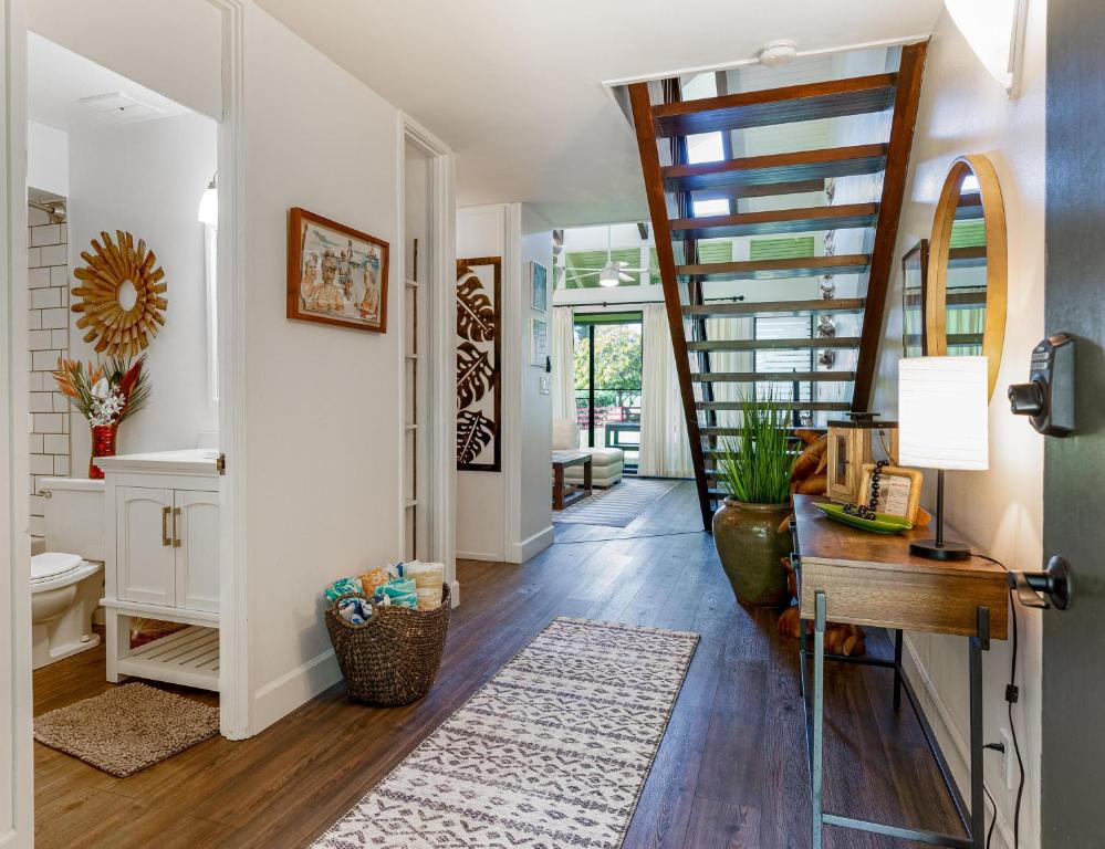 a hallway of a home with a spiral staircase at Turtle Bay Kuilima Collection 6 West in Kahuku