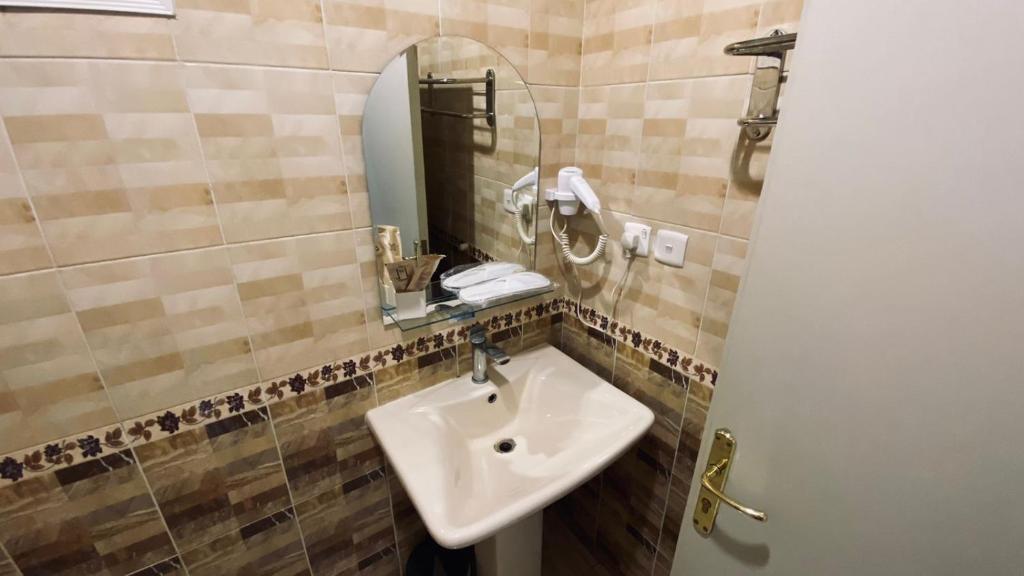 Koupelna v ubytování Quel Serviced Units