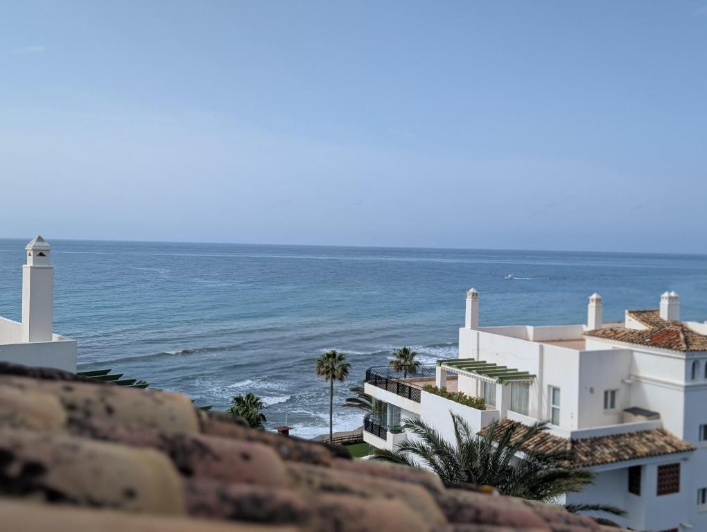 a view of the ocean from a building at Beautiful first line Penthouse with Sea View Mi Capricho in Mijas Costa