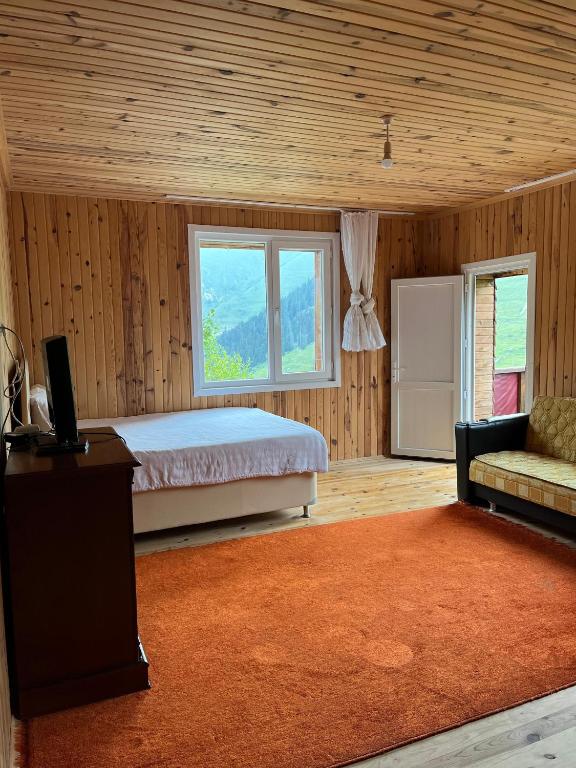 Postel nebo postele na pokoji v ubytování DORUK Pansiyon