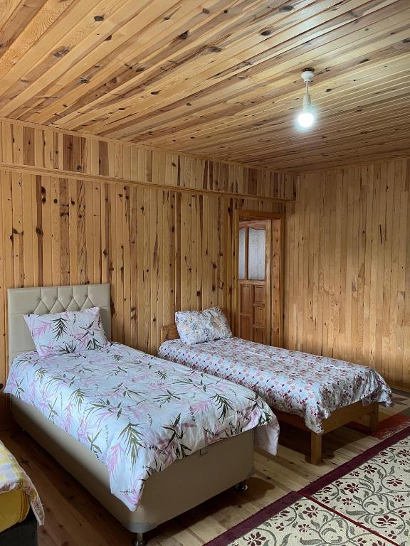 Postel nebo postele na pokoji v ubytování DORUK Pansiyon