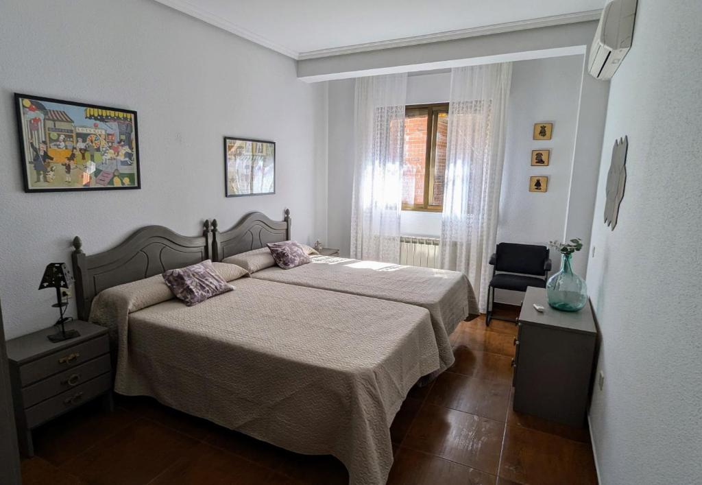 Giường trong phòng chung tại Apartamento El Parral