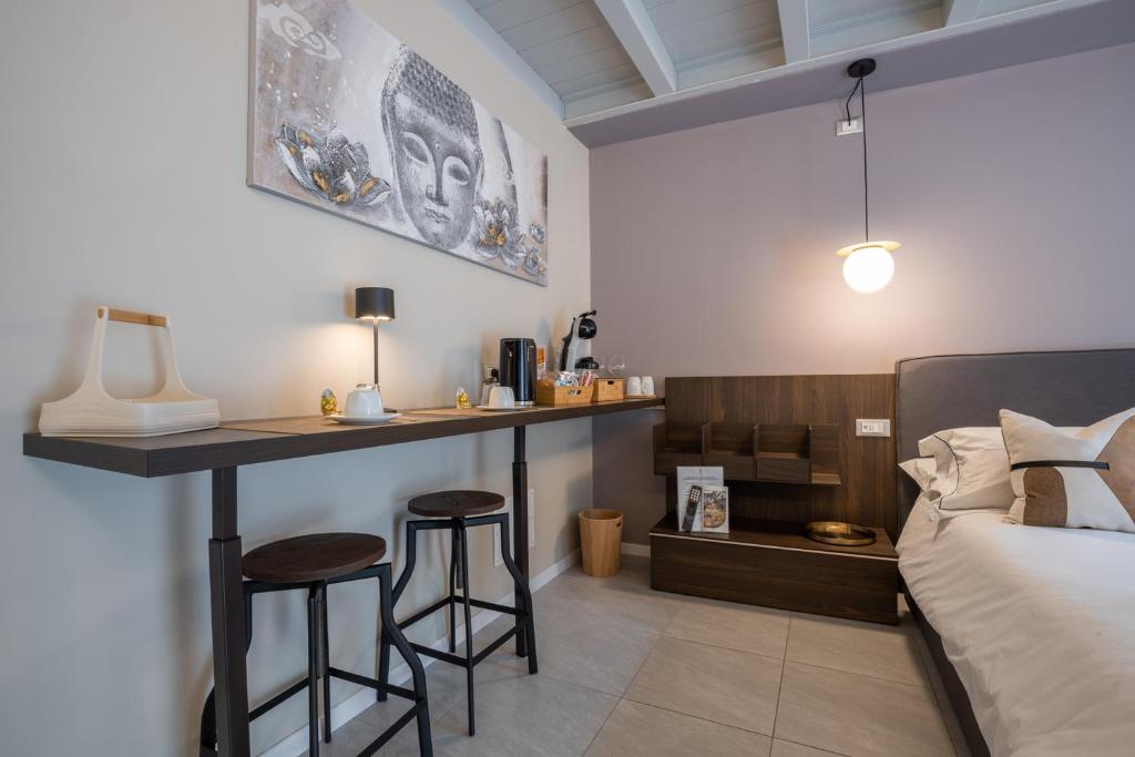 Postel nebo postele na pokoji v ubytování ES Rooms and Apartments