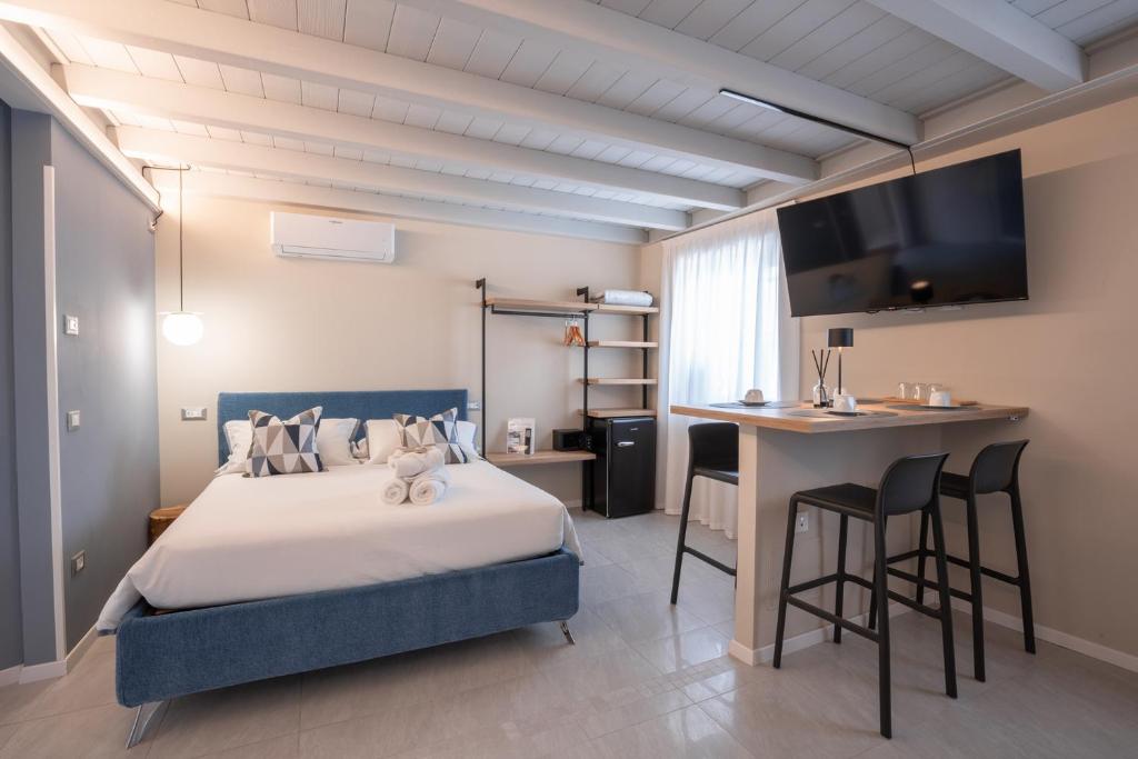 Postel nebo postele na pokoji v ubytování ES Rooms and Apartments