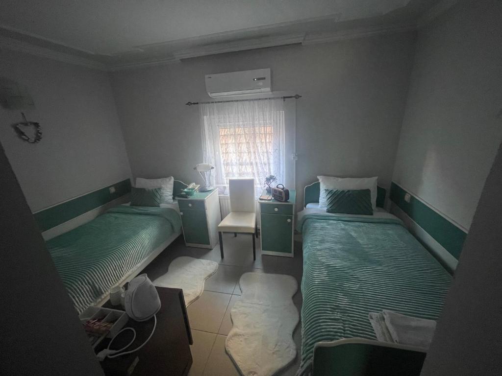 Postel nebo postele na pokoji v ubytování Garni Hotel Bella