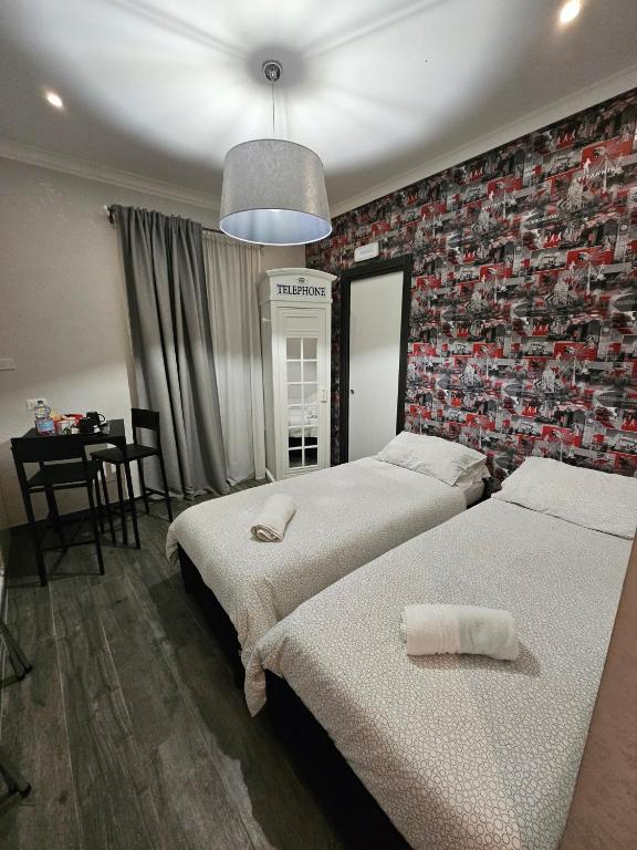 Postel nebo postele na pokoji v ubytování B&B Notti d'Oriente