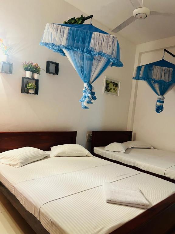 Postel nebo postele na pokoji v ubytování INTEC Kedella Guest