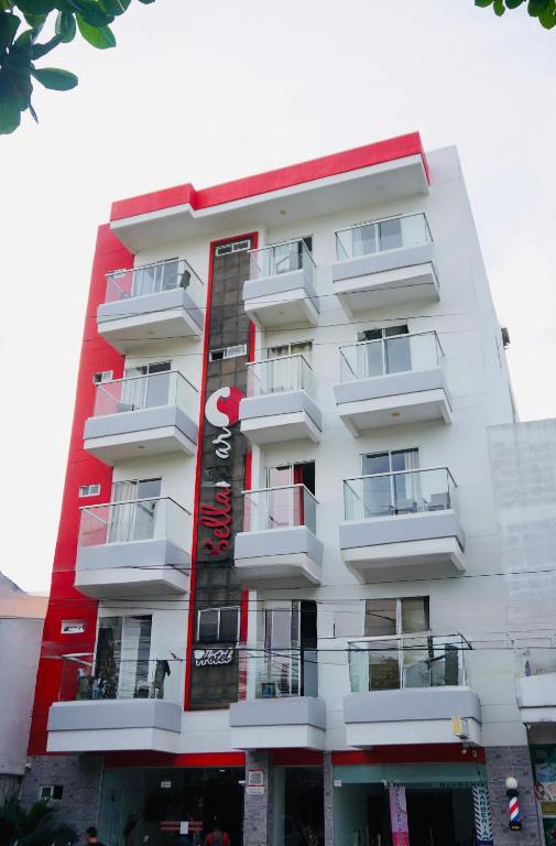 a white building with a red and white at HOTEL BELLAMAR in Cartagena de Indias