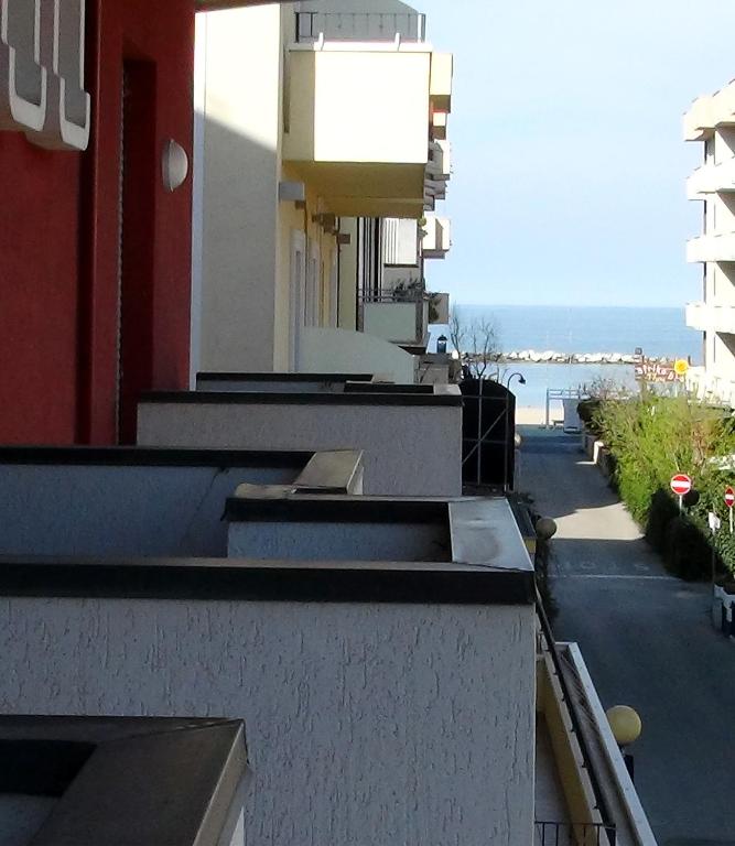 an apartment building with a view of the ocean at Hotel La Caravella in Bellaria-Igea Marina