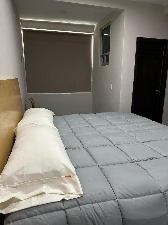 Postel nebo postele na pokoji v ubytování MR Hotel