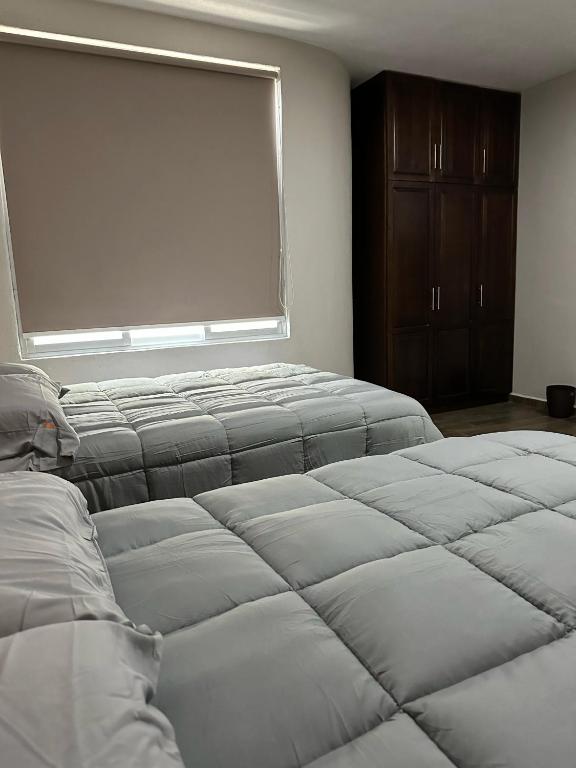 Postel nebo postele na pokoji v ubytování MR Hotel