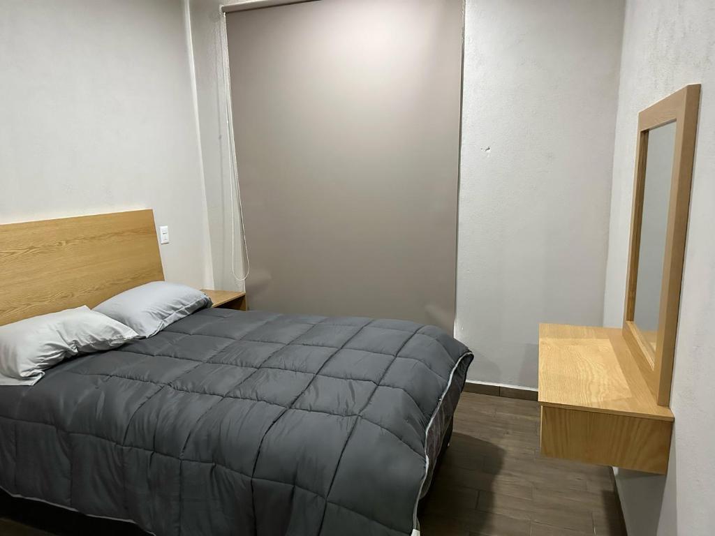 Postel nebo postele na pokoji v ubytování MR Hotel