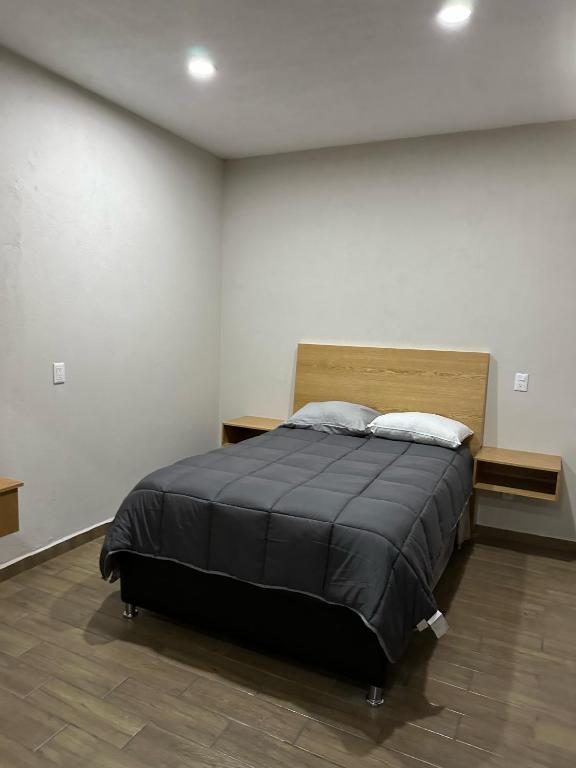 Postel nebo postele na pokoji v ubytování MR Hotel