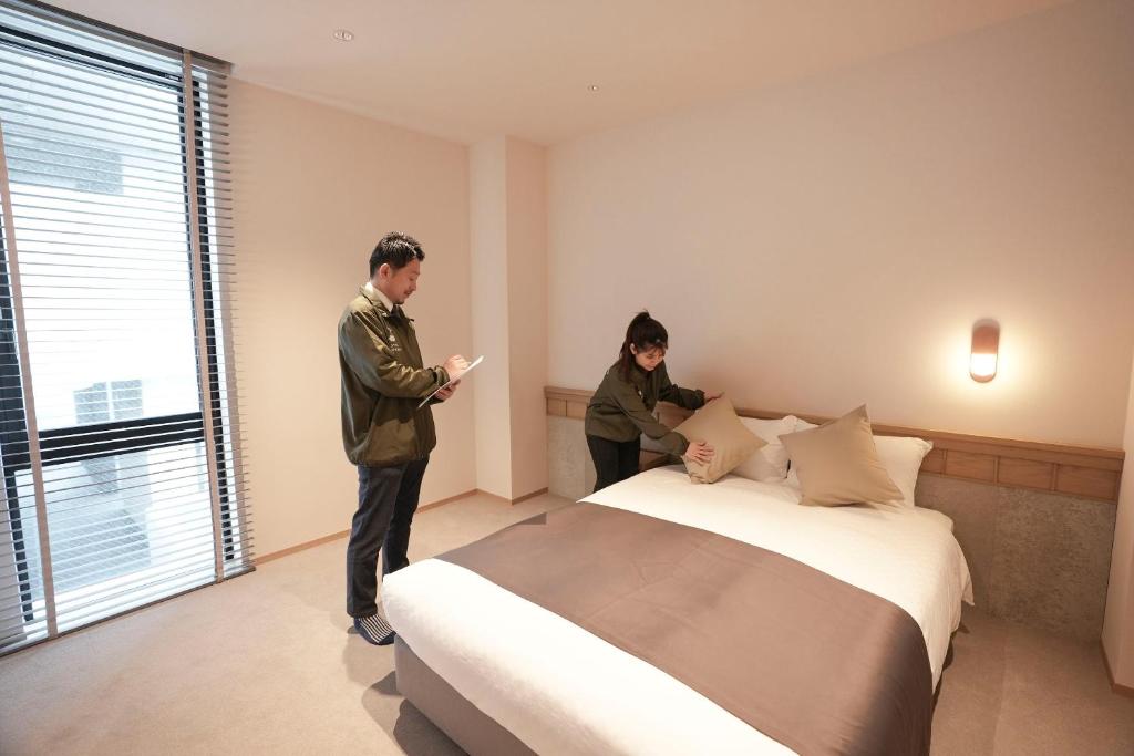 Postel nebo postele na pokoji v ubytování Hotel S-Presso South II