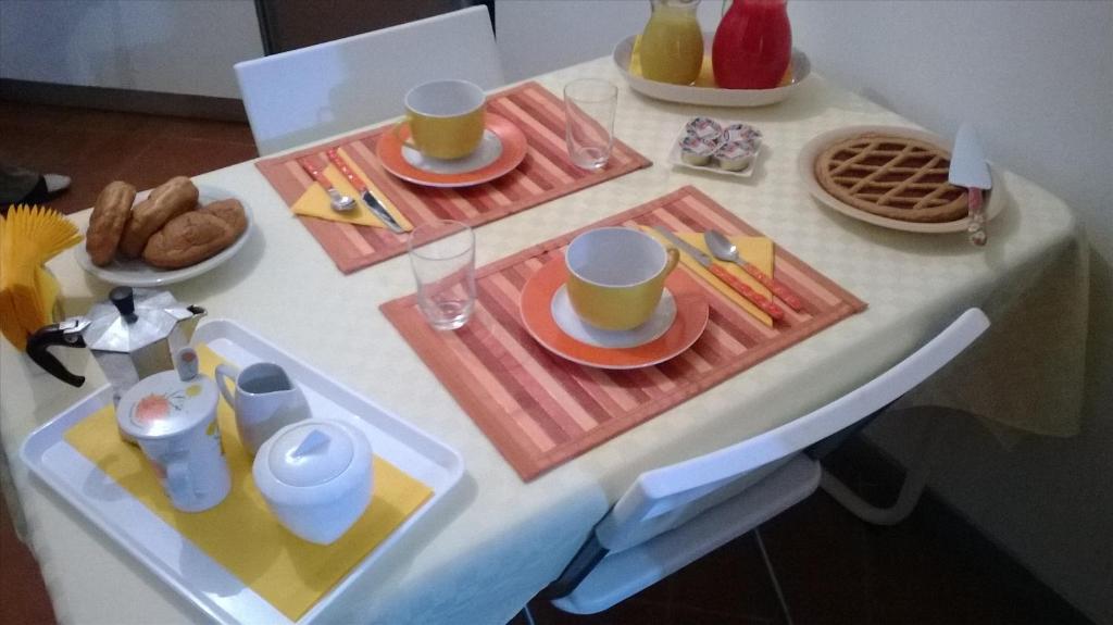 a table with breakfast foods and drinks on it at Caracciolo B&B in Fiano Romano