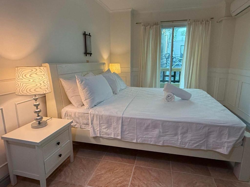 Postel nebo postele na pokoji v ubytování Boracay Paradise Hotel