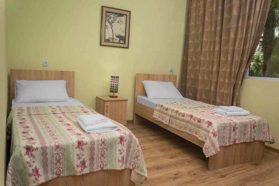 Postel nebo postele na pokoji v ubytování Cottages Babila