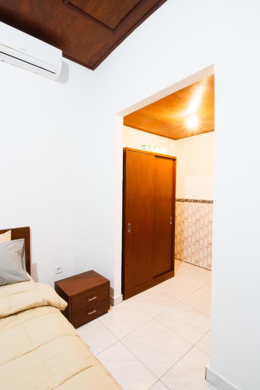 Postel nebo postele na pokoji v ubytování Timbul Homestay