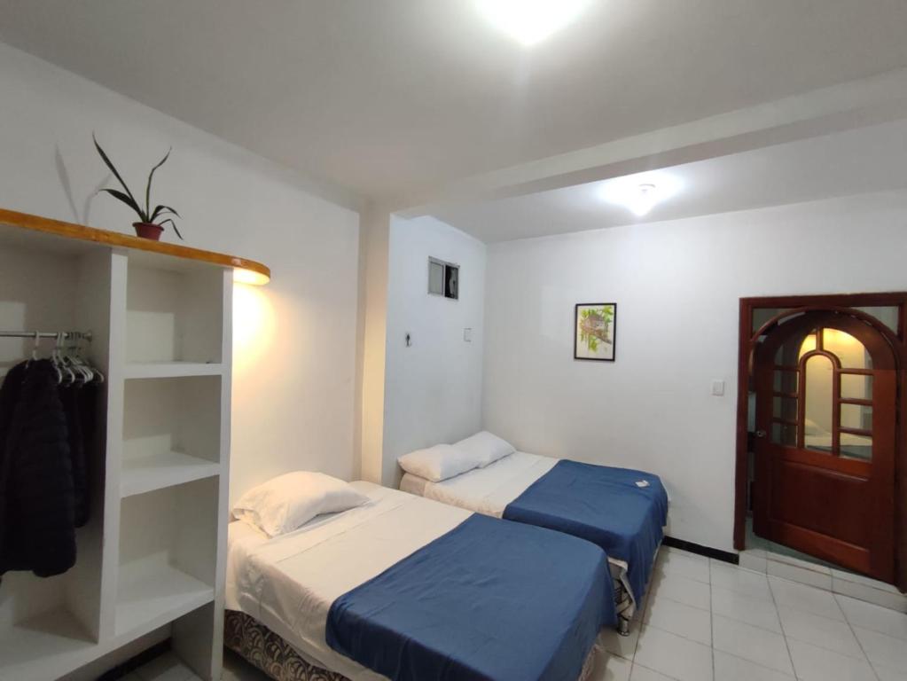 Postel nebo postele na pokoji v ubytování casa Huanuco hospedaje