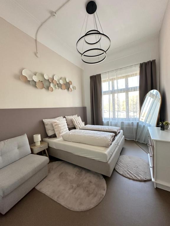 Ένα ή περισσότερα κρεβάτια σε δωμάτιο στο Villa Rosenau in Herzens Nürnberg