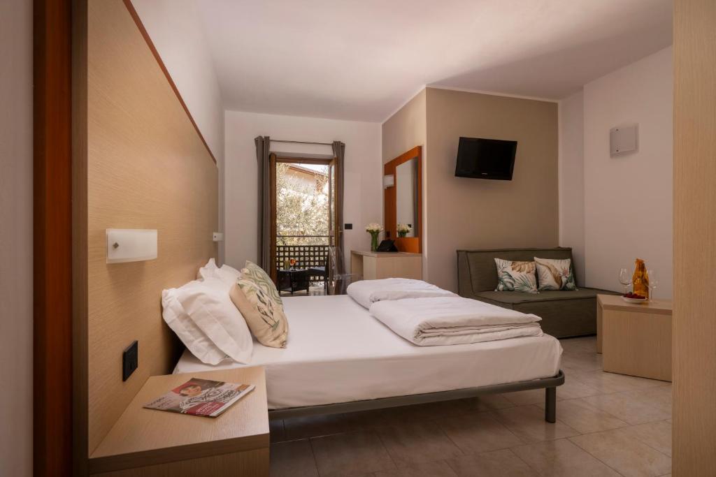 Posteľ alebo postele v izbe v ubytovaní Hotel Coste