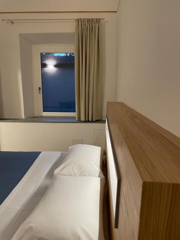 Postel nebo postele na pokoji v ubytování Il Genio - Residenza D'Epoca