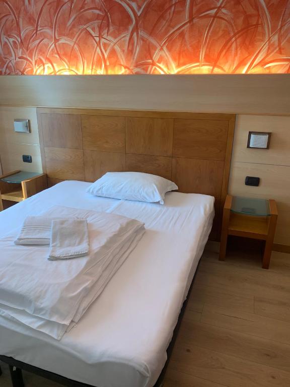 Postel nebo postele na pokoji v ubytování Hotel Garnì Delle Rose