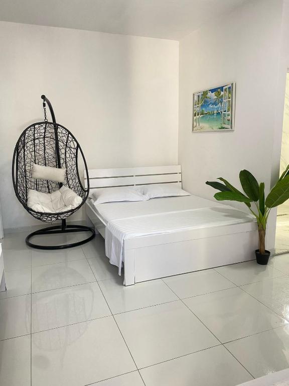 Postel nebo postele na pokoji v ubytování Rai Rooms