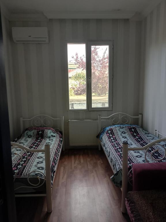 Postel nebo postele na pokoji v ubytování Jesis Batumi