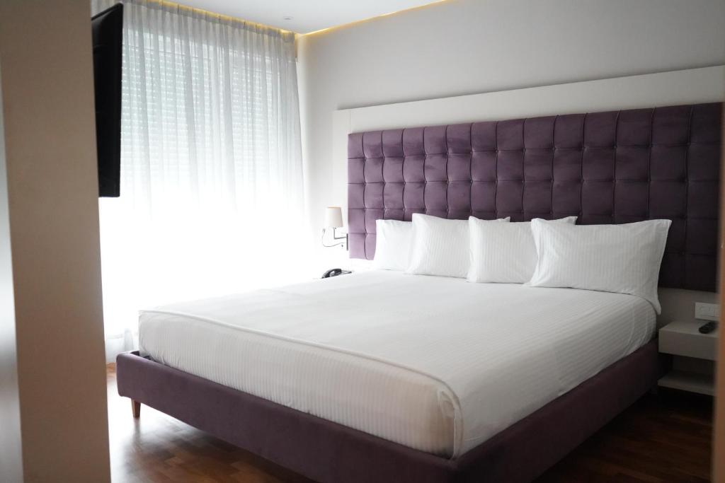 Postel nebo postele na pokoji v ubytování Bougainville Bay Hotel