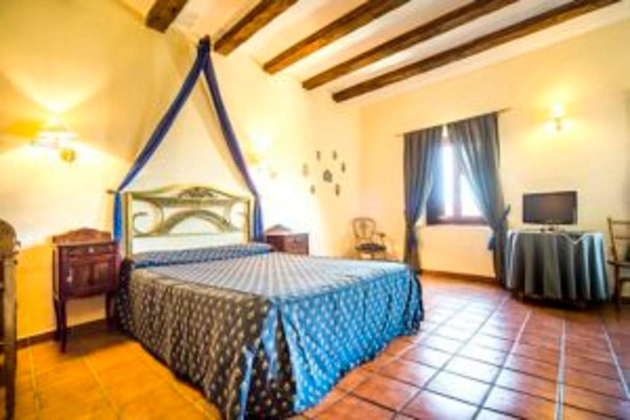 Postel nebo postele na pokoji v ubytování La Hostería de Oropesa