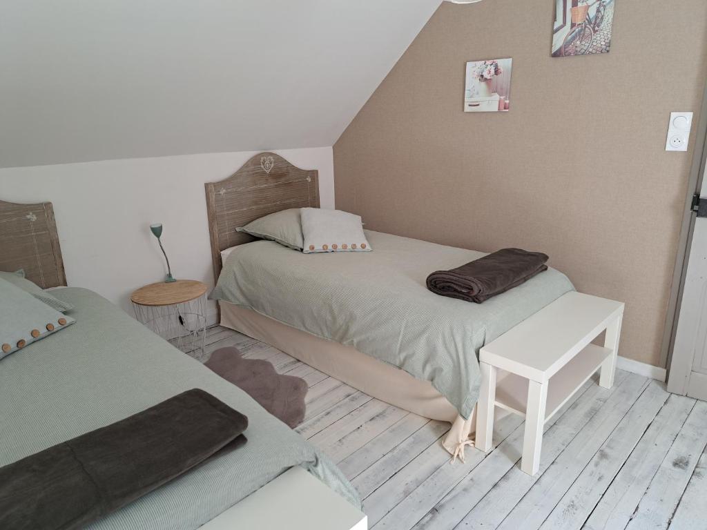 Postel nebo postele na pokoji v ubytování Gîte de la Belle Roze