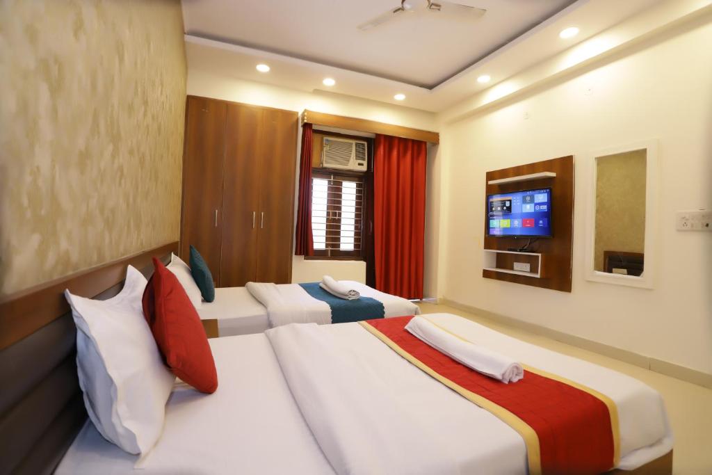 Postel nebo postele na pokoji v ubytování Hotel Luxe Stay Near Delhi Airport