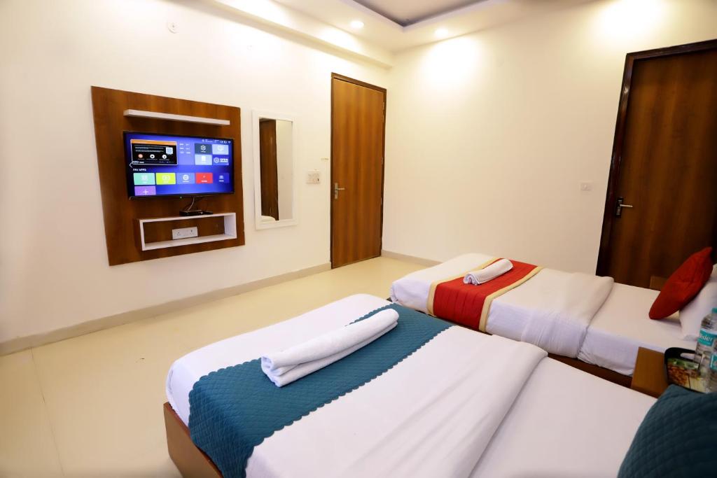 Postel nebo postele na pokoji v ubytování Hotel Luxe Stay Near Delhi Airport
