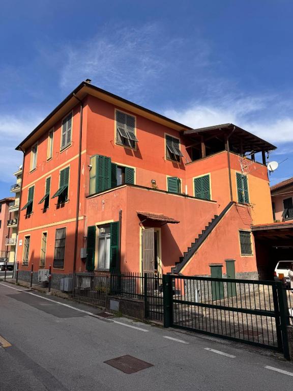 a large orange building on a city street at Cozy HOUSE in San Salvatore